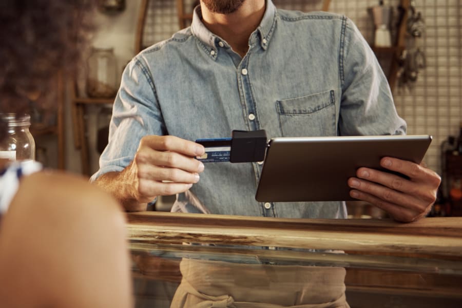 business owner using credit card processor