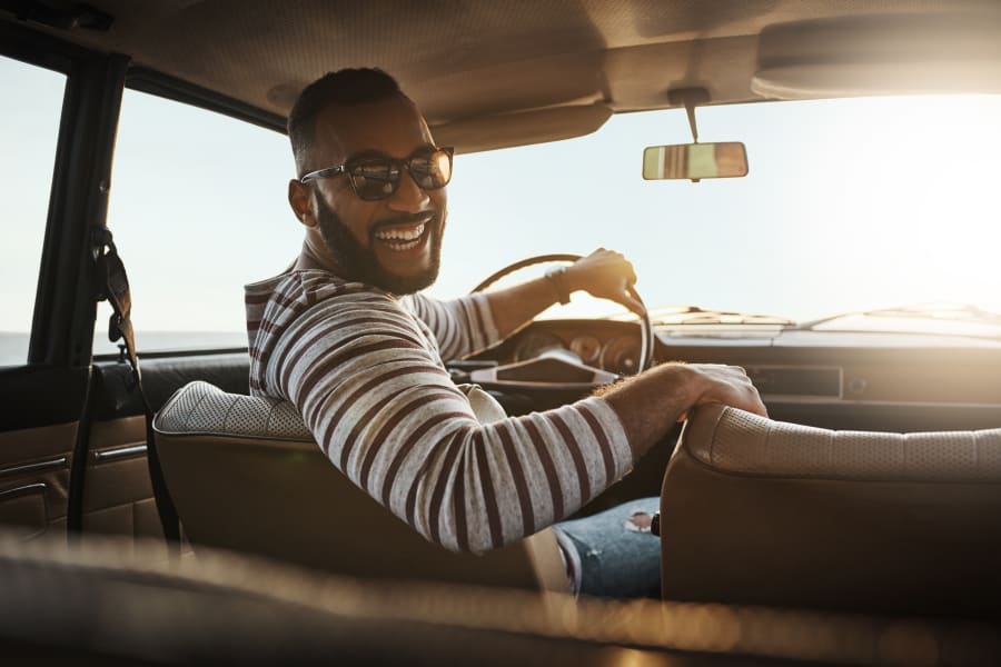 Young man driving in car