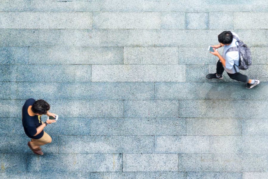people walking and texting
