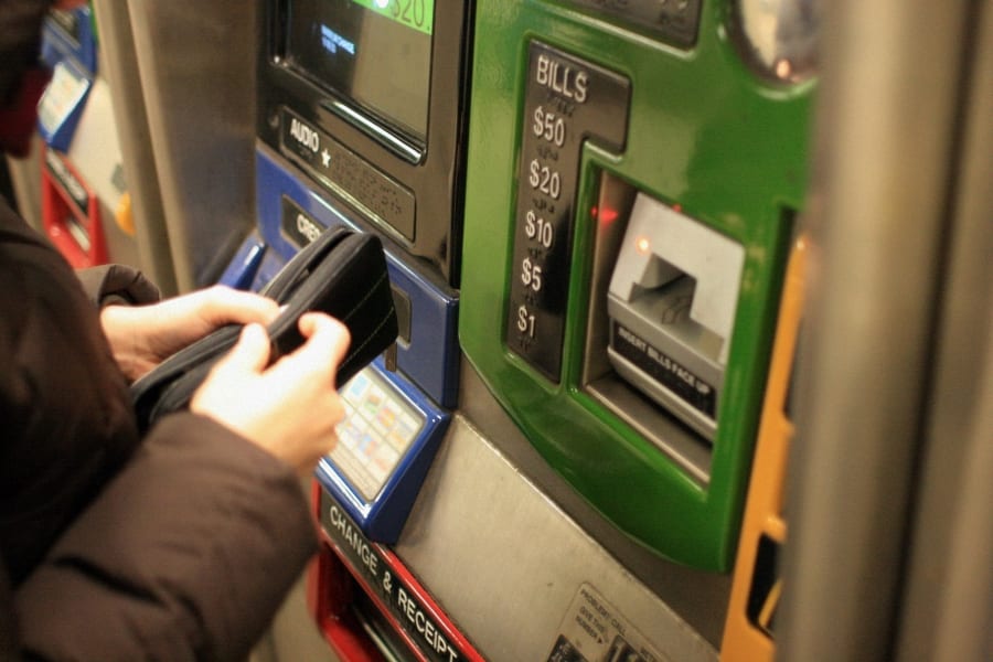 person buying metrocard to commute