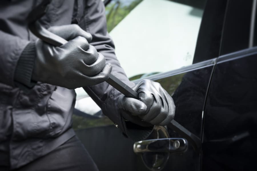 A person breaking into a car