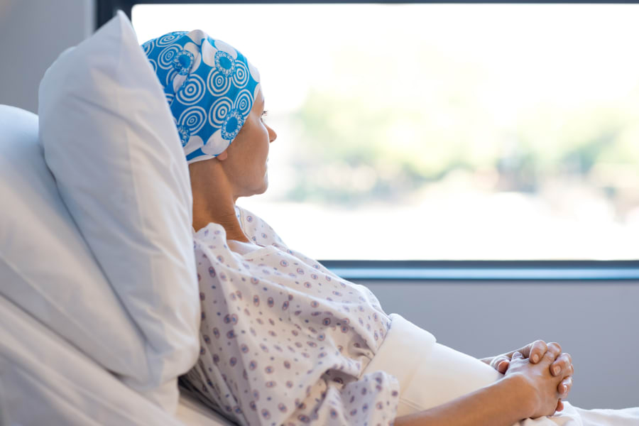 A female cancer patient resting in bed
