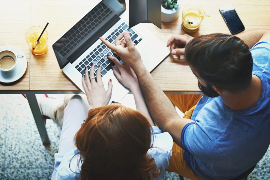 Couple looking at computer.