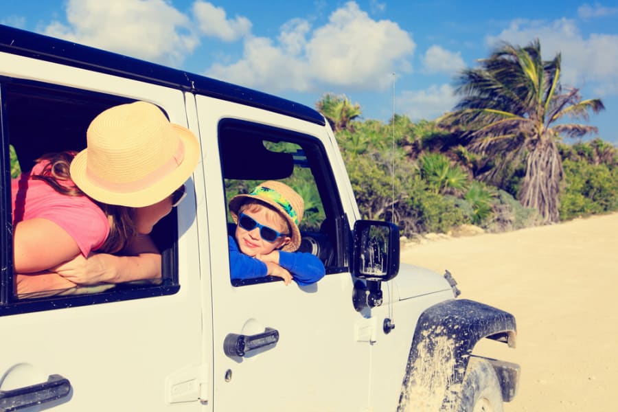 family driving car to beach