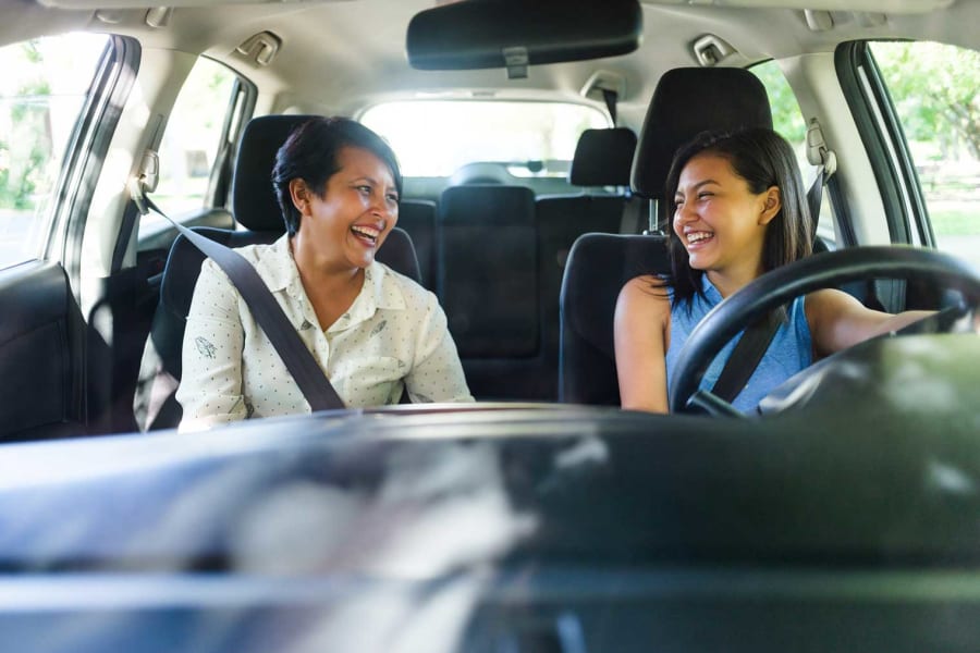 A mother in the car with her teen driver.