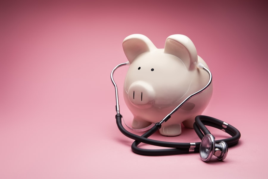 A piggybank and a stethoscope