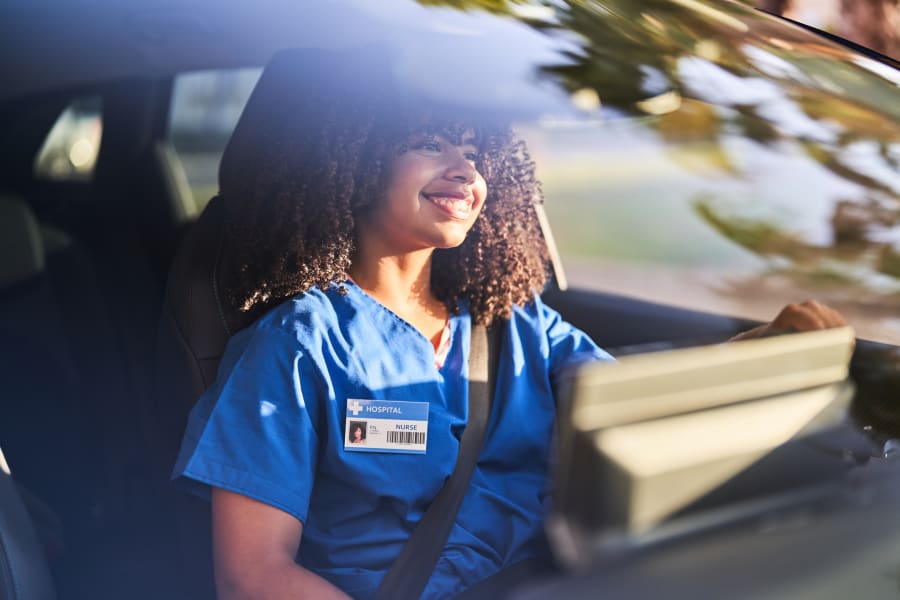 Nurse driving a car
