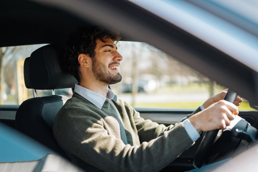 Young man driving a car
