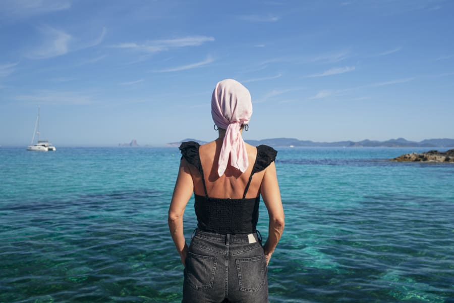 Cancer survivor enjoys the beach.