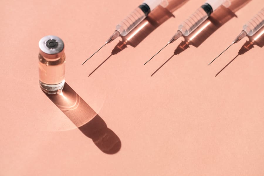 Syringes and a vial of liquid