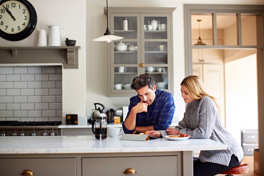couple in kitchen deciding about freezing eggs