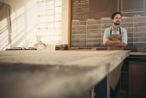 owner of small bakery in work area