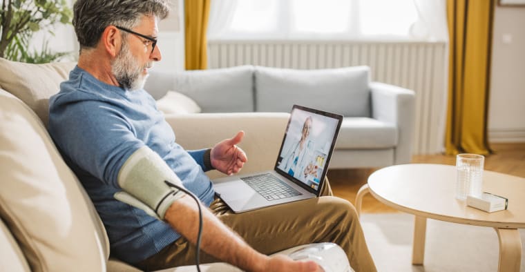 Man talking on video call with his doctor