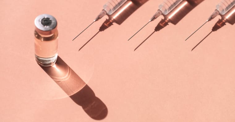 Syringes and a vial of liquid