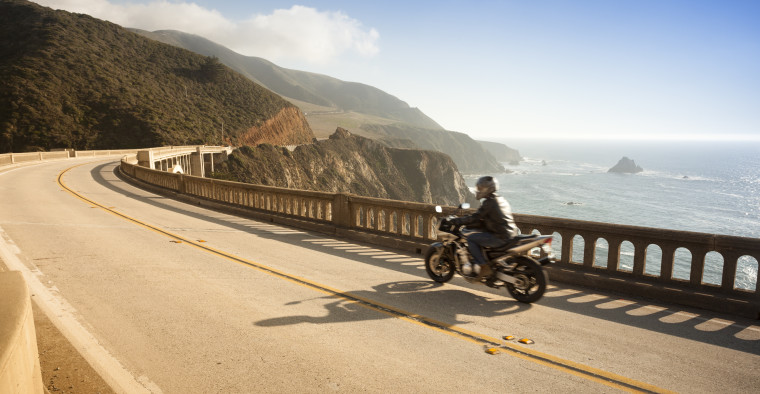 Motorcycle crossing the Bixby Bridge, Big Sur, California, USA