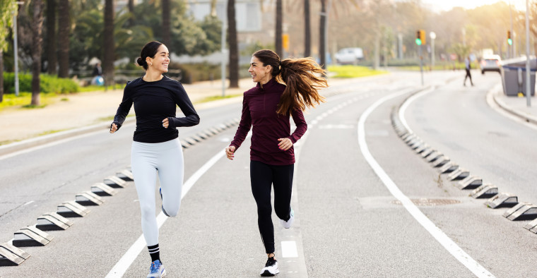 Two runners on a road