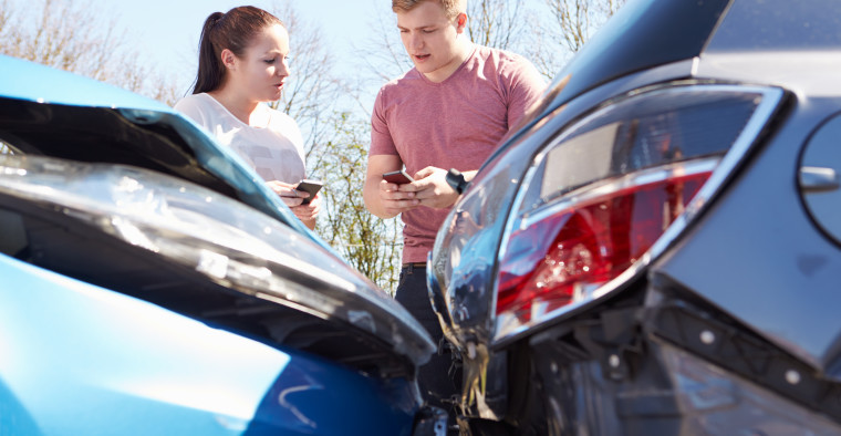 Two Young People Exchange Insurance Informatio