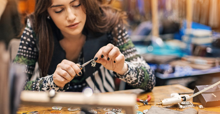 woman fixing jewelry