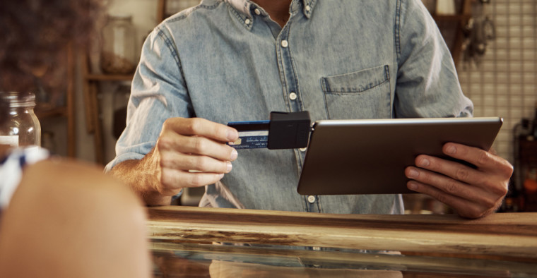 business owner using credit card processor