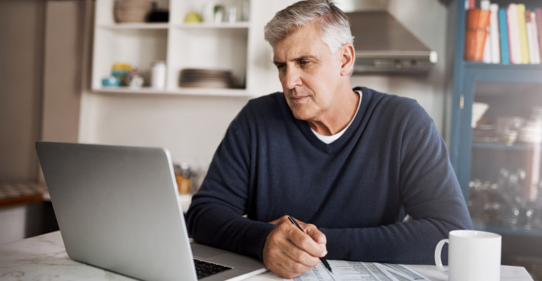 Man reviews his financial situation