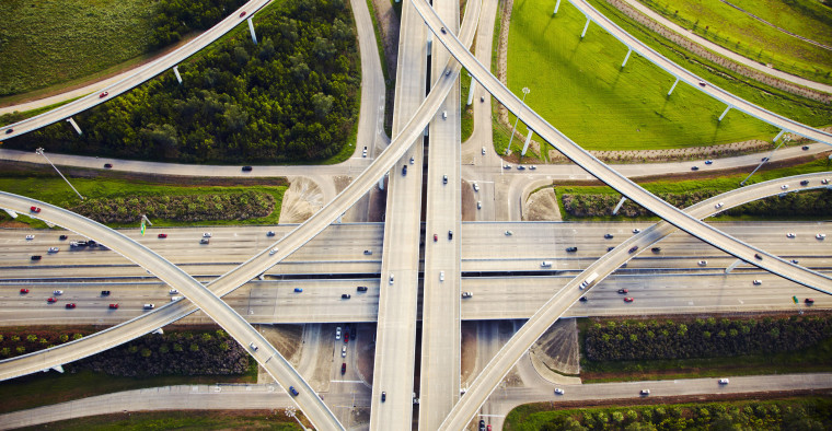 Aerial view of traffic and overpasses.