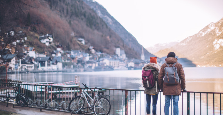 Couple standing next to their bikes