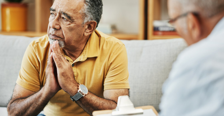 Older man getting billing information
