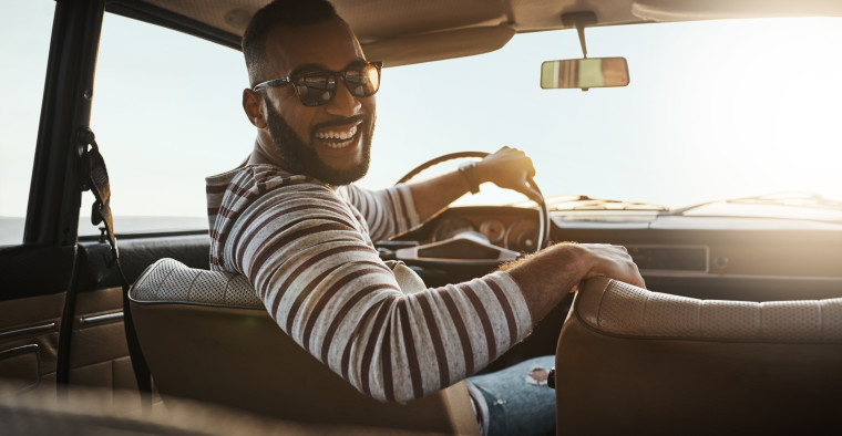 Young man driving in car