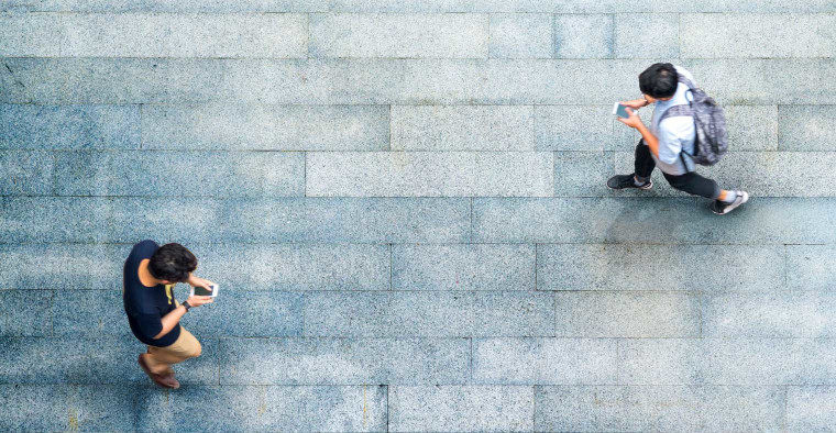 people walking and texting