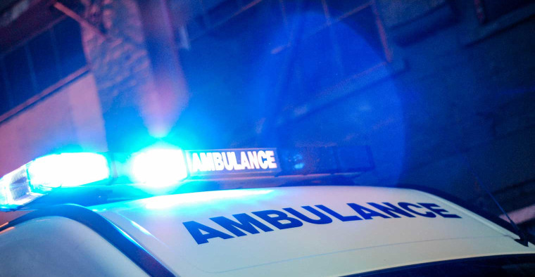 An ambulance with overhead lights.
