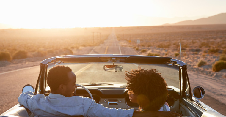 Couple driving a convertible