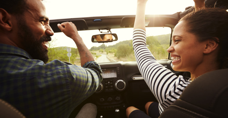 Couple in their 30s driving