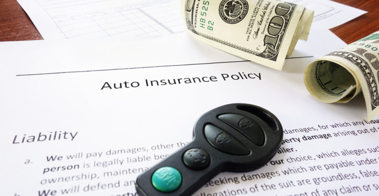Car insurance policy with money and keys
