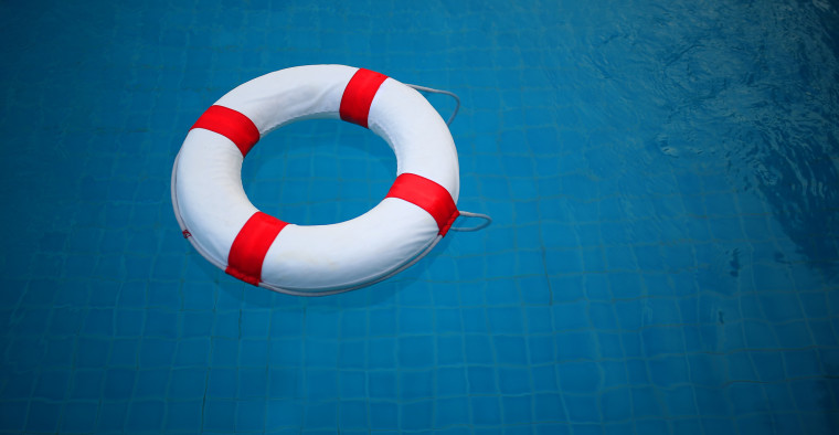 A buoy rests in the water.