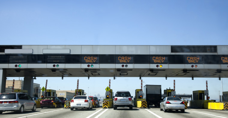 Cars driving through a toll