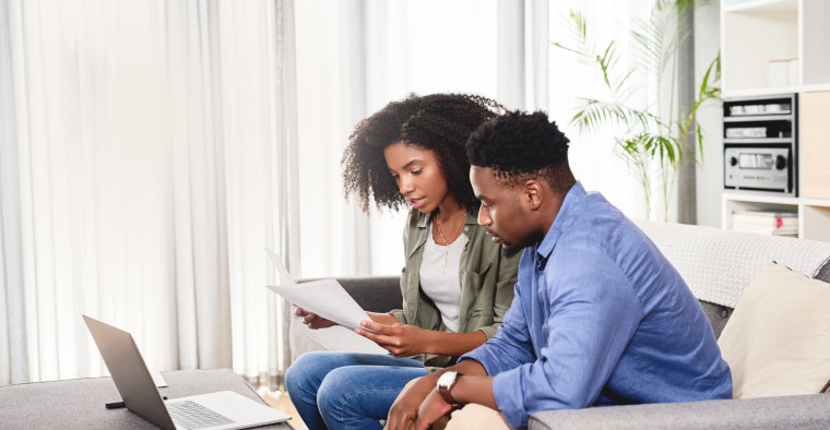 Couple reviewing their Gold health insurance