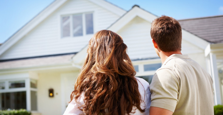 A couple looking at a house
