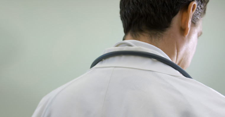 A doctor thinks about his patient’s diagnosis.