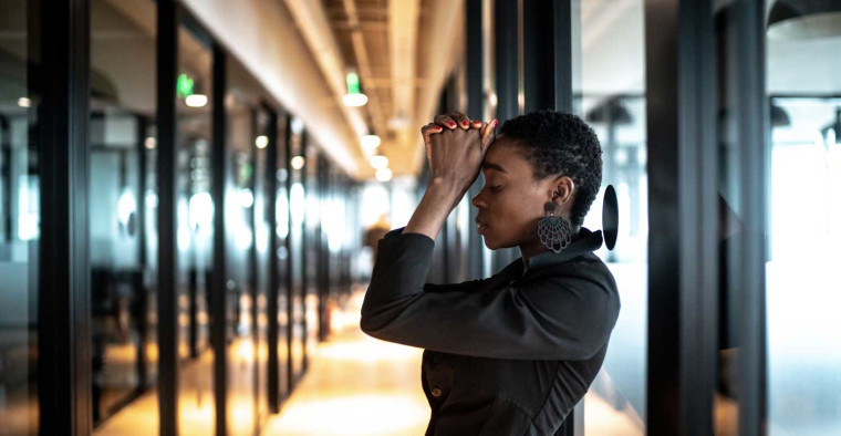 A woman feels anxious at work.