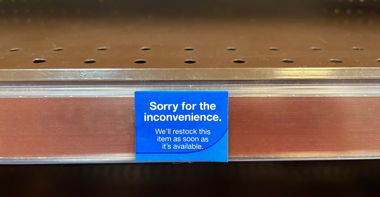 An empty shelf in a pharmacy.