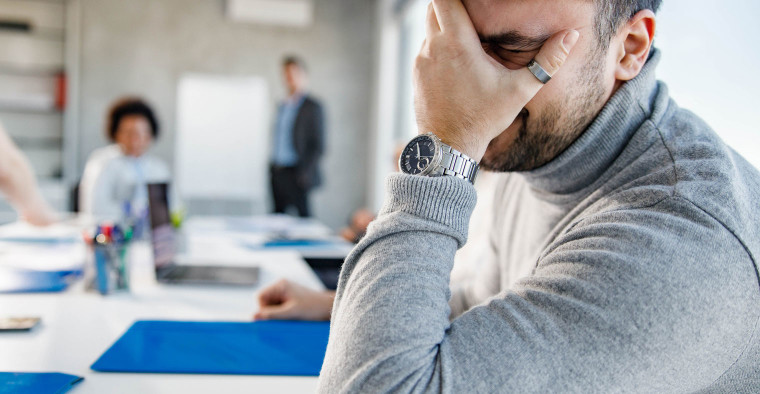 frustrated employees in a meeting