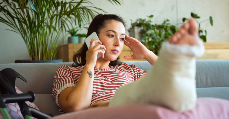 A woman with a broken leg.