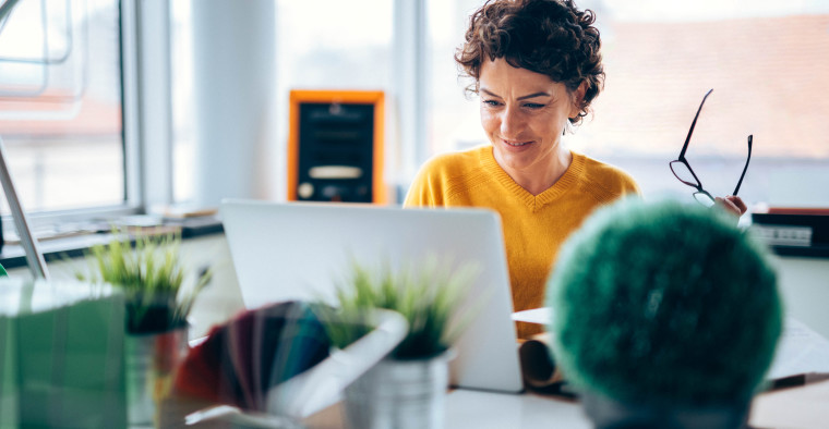 Happy business woman reading