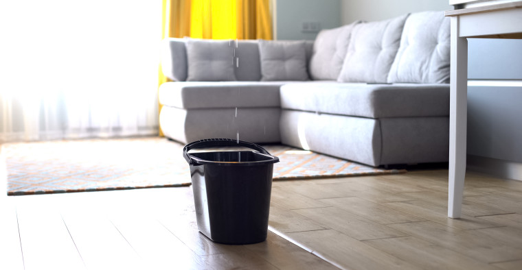 A living room with water damage.