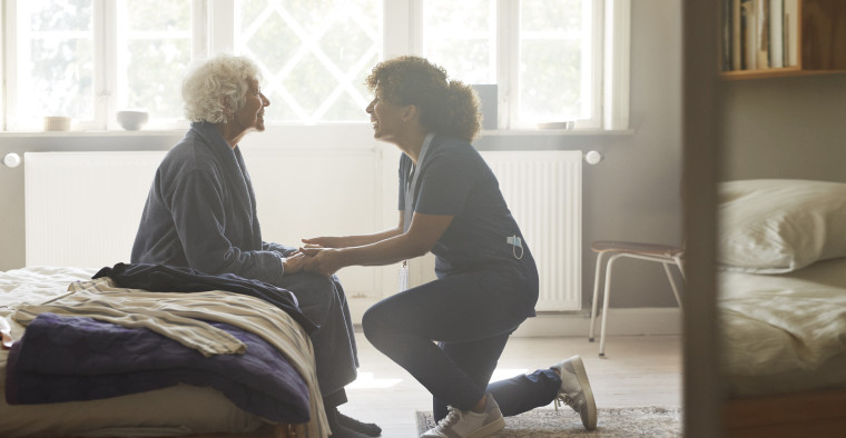 In-home caregiver and senior woman