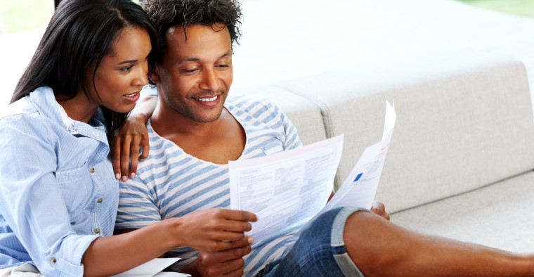 Couple reading life insurance policy
