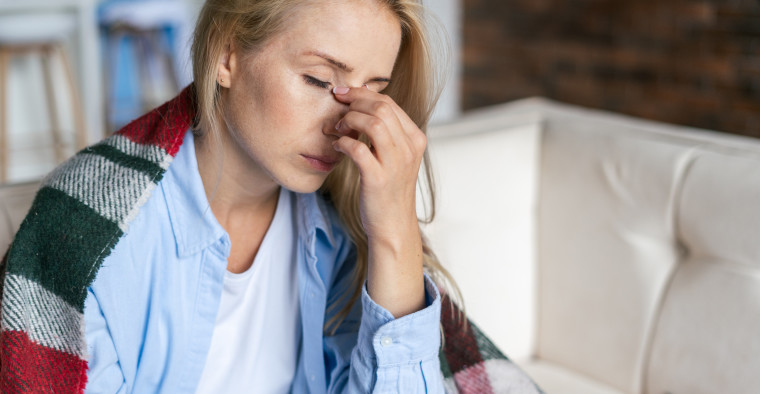 A woman suffering from long COVID symptoms.