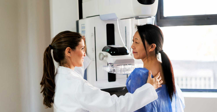 A woman getting a mammogram.