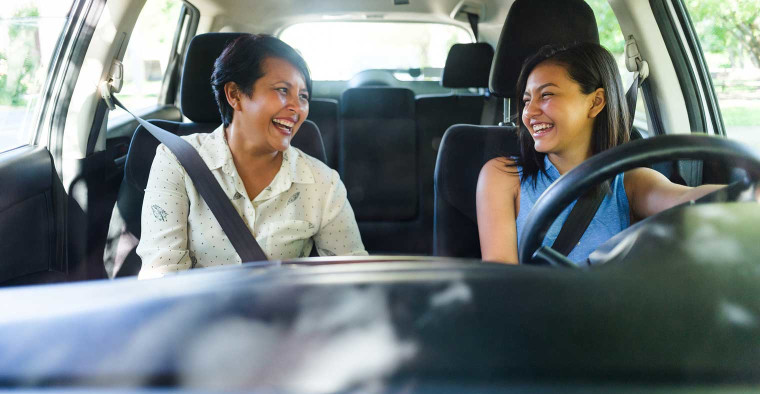 A mother in the car with her teen driver.