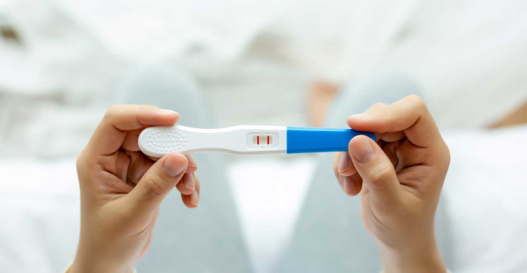 A positive pregnancy test.